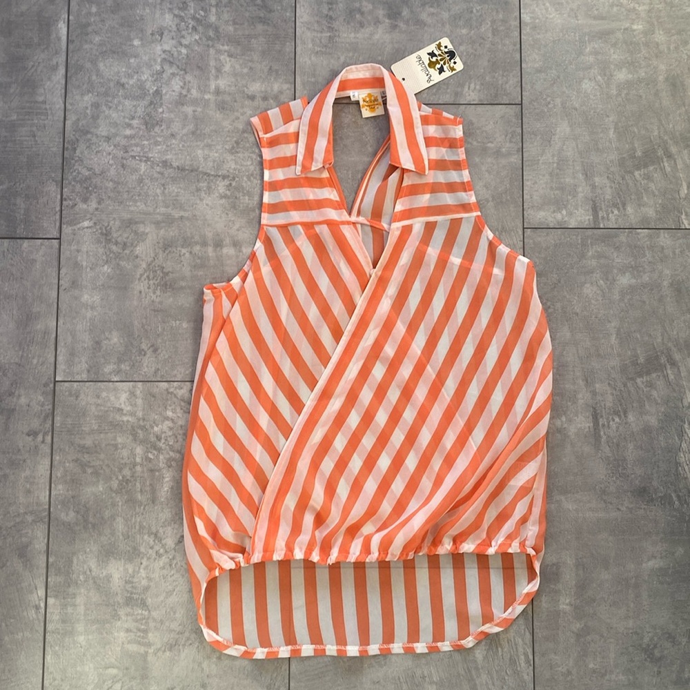 New with tags. Selling because I’ve never worn it. Closet clean out.